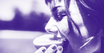 Woman Eating Orange Slice