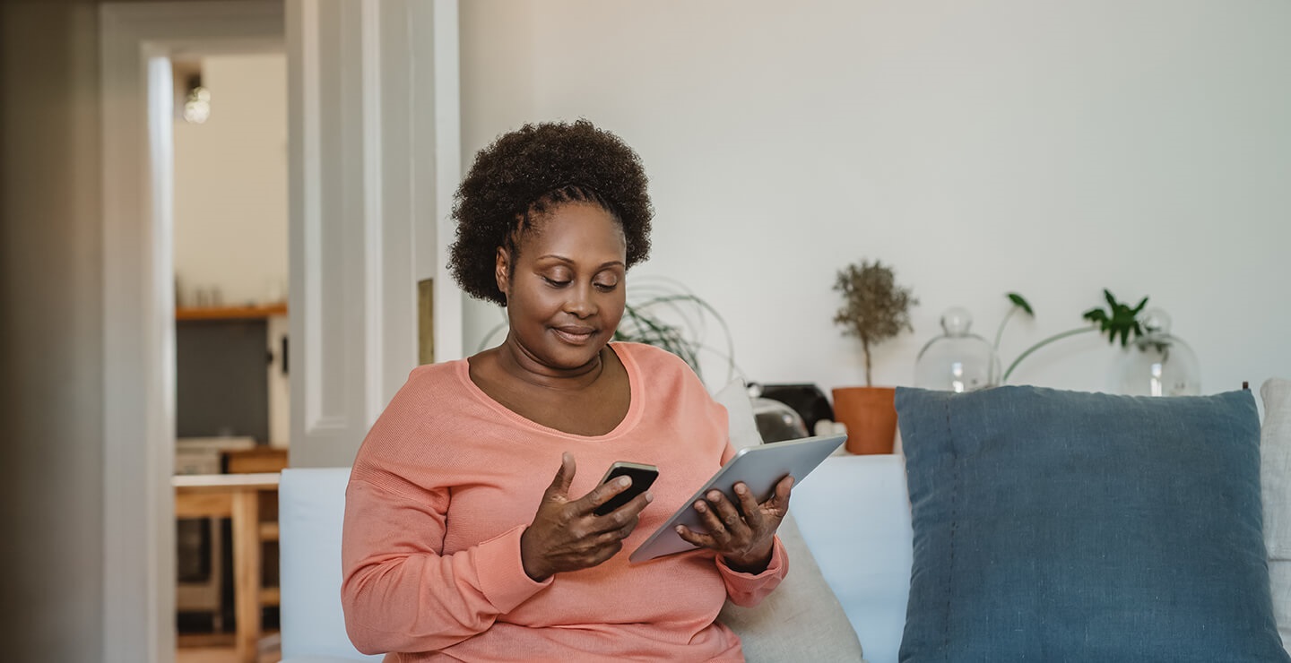woman on tablet on sofa
