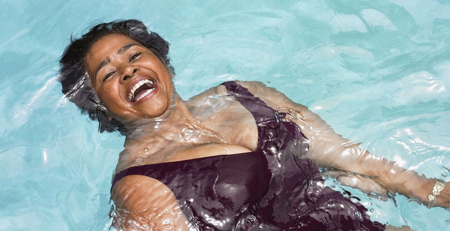 woman floating in pool