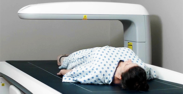 A patient undergoes a Dual Energy X-ray Absorptiometry scan to measure whole-body composition (DXA0 to measure 