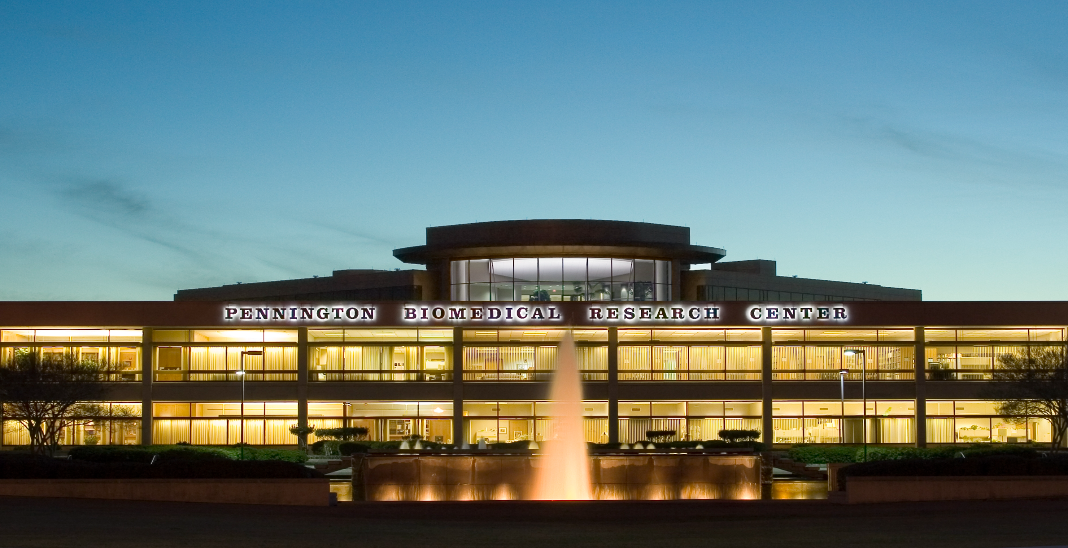 Facade of Pennington Biomedical Research Center at dusk