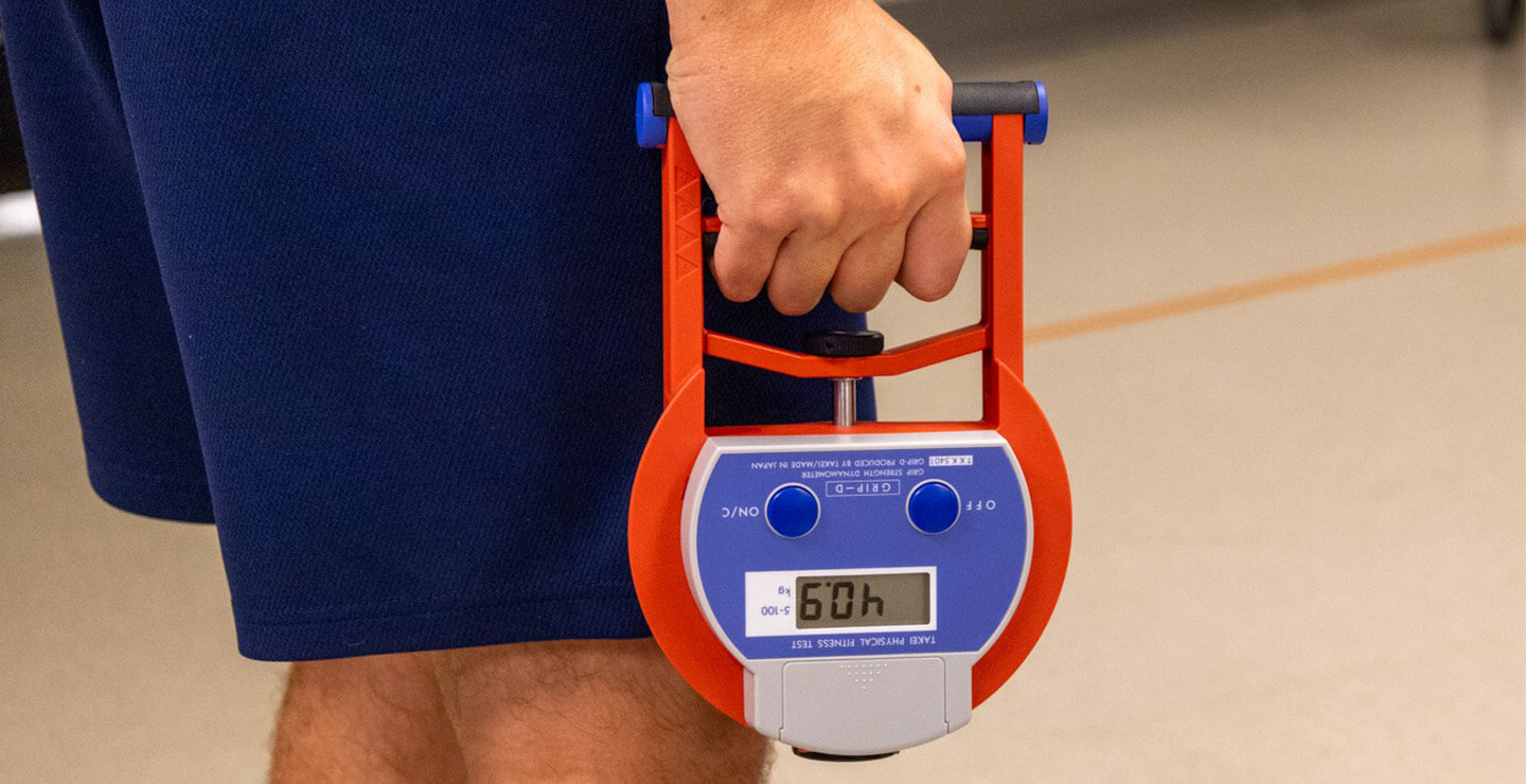 study participant using a grip strength tester