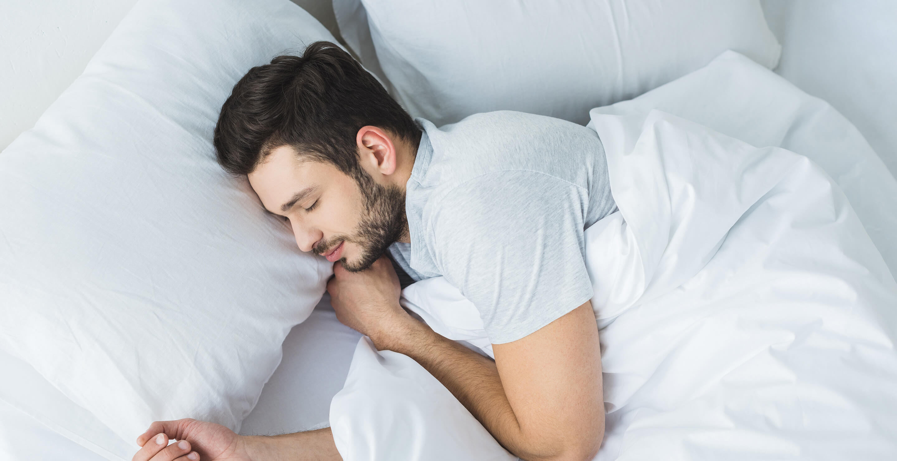 A man sound asleep in bed