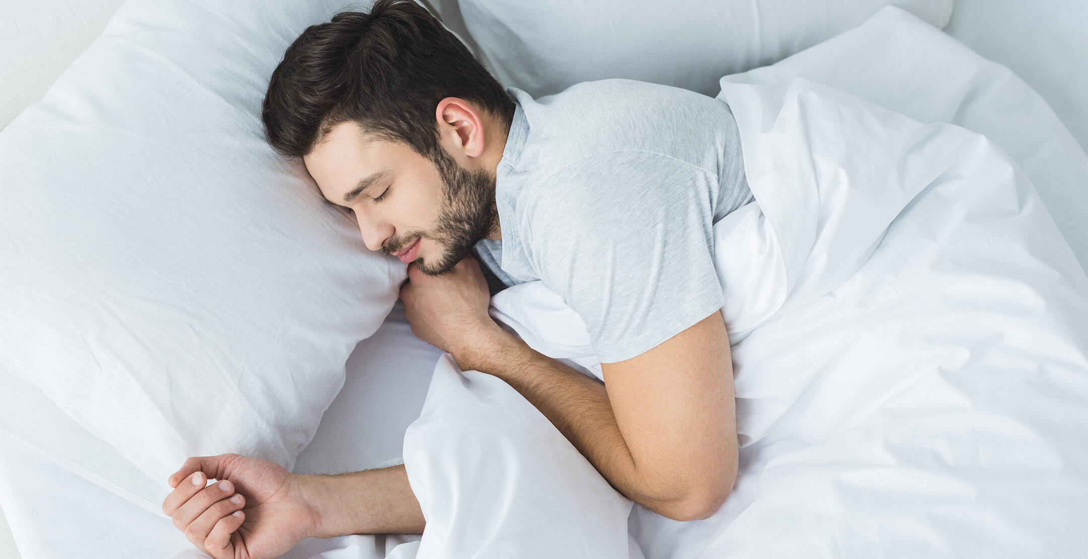 A man sound asleep in bed